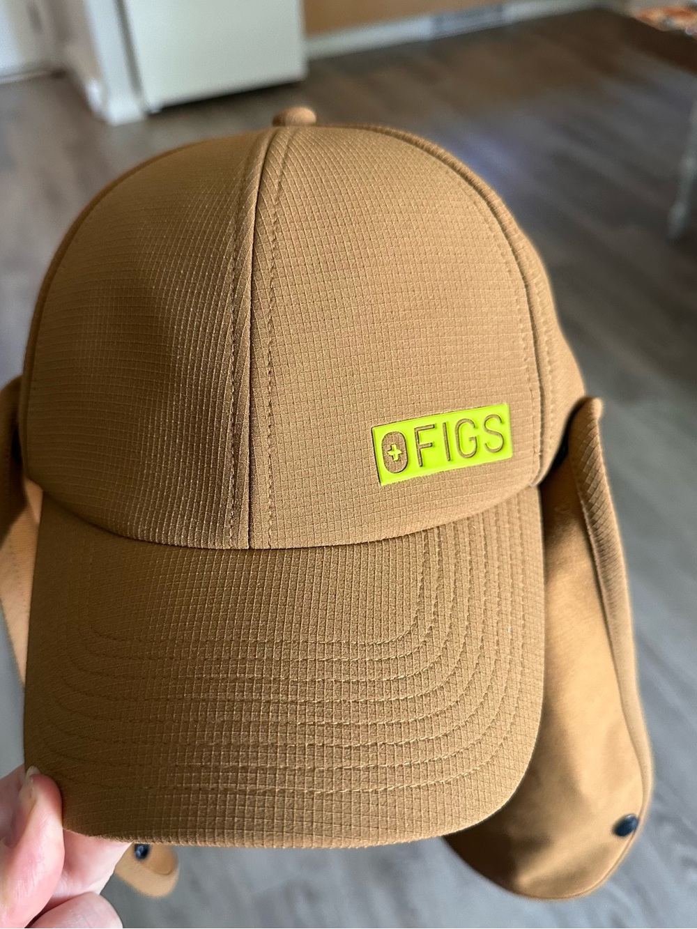 Figs Indestructible hat with Neon Yellow Logo and Removable Ear Flaps